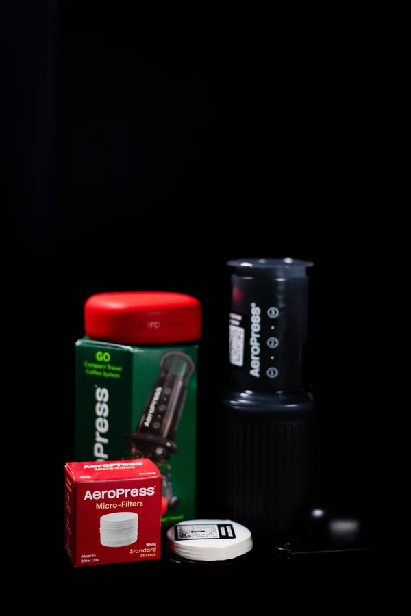 AeroPress Go travel coffee maker with compact drinking mug and silicone lid